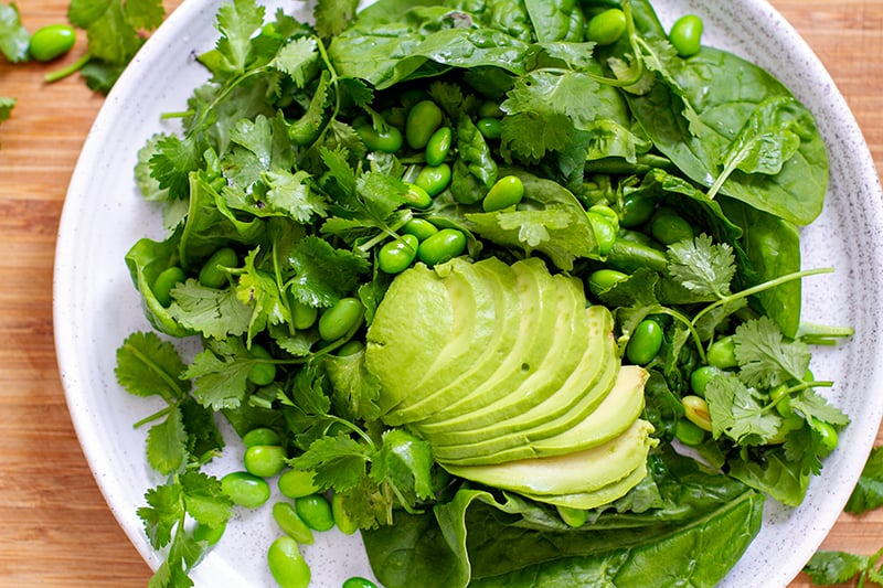 Assembling the salad - green veggies