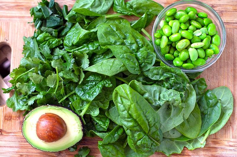 Leafy green salad ingredients and edamame
