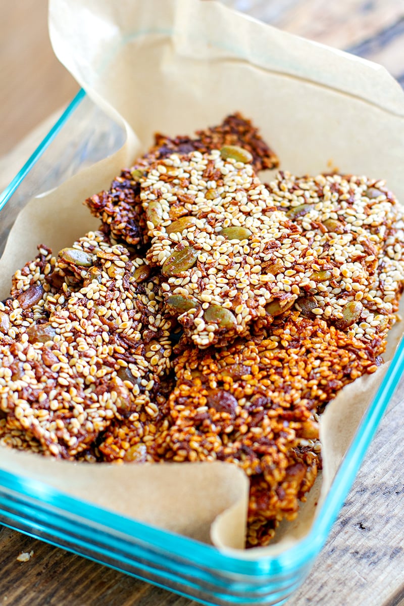 Sesame snaps squares stored in glass Tupperware