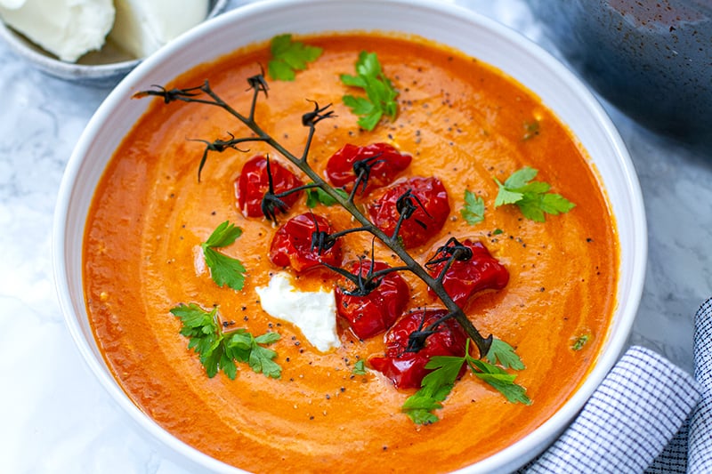 Tomato bisque soup with roasted cherry tomatoes and mascarpone