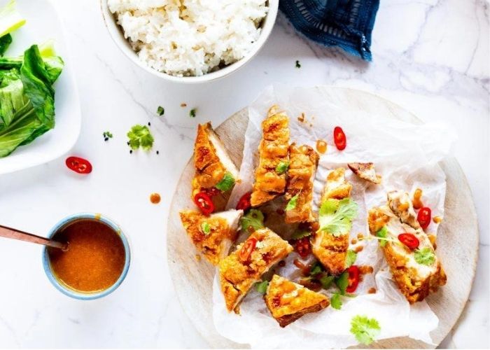 Crispy pork belly with peanut sauce and bok choy